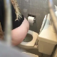 A hidden camera records an unsuspecting, plump blonde woman using a toilet in a public restroom while having explosive diarrhea. She leans forward while shitting & pissing, allowing some poop action to be seen. Vertical format video. Over 2.5 minutes.